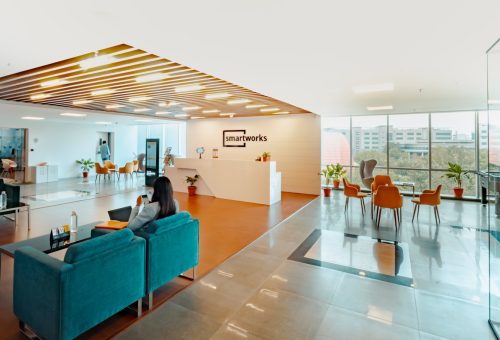 unknown person sitting on blue couch